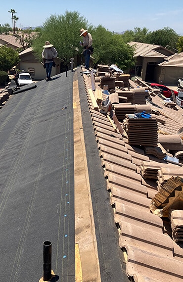 Stacked roofing tiles ready for an Allstate Roofing install